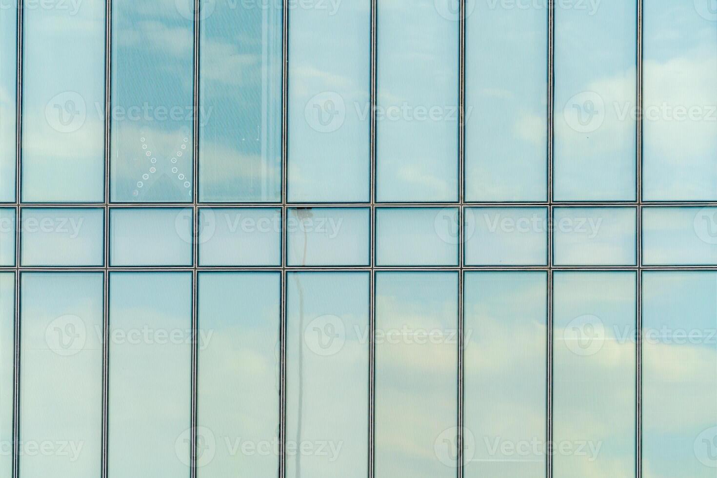 Glass facade of a modern building. Construction and rental housing. photo