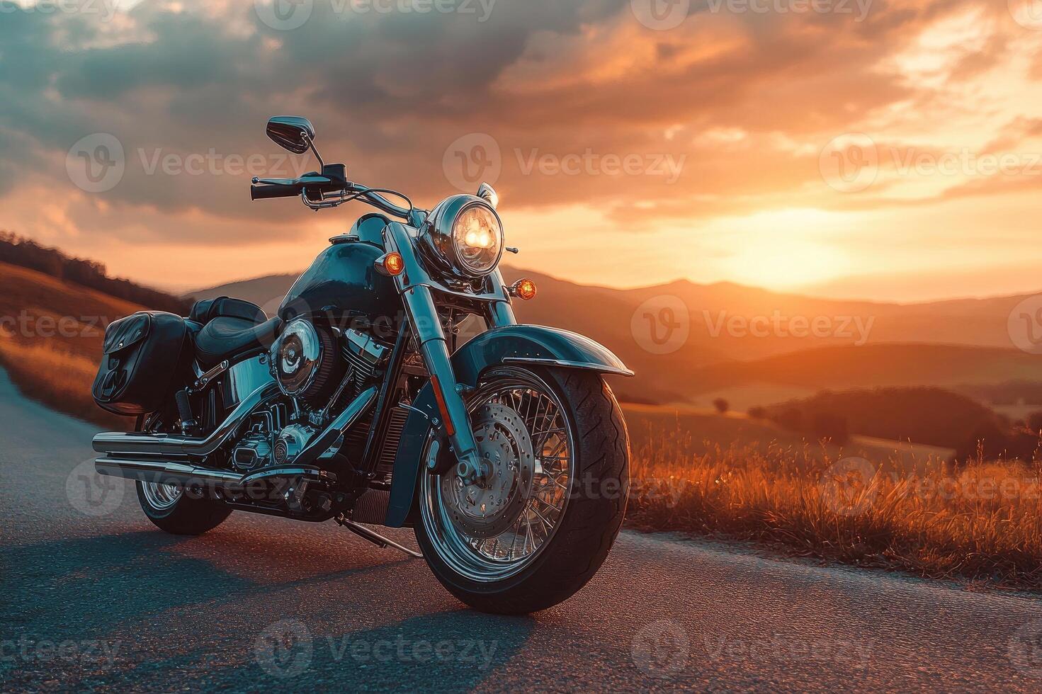 Black motorcycle parked on country road at sunset photo