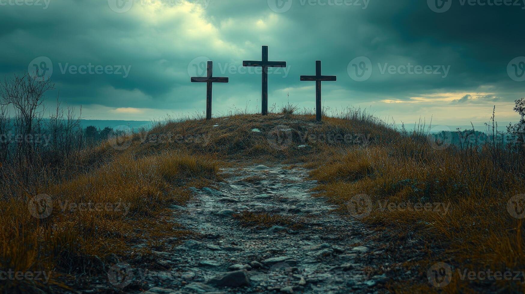 Three crosses standing on a hill under dramatic sky photo