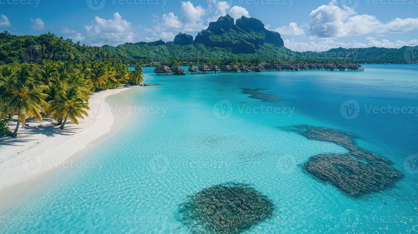 Turquoise lagoon water surrounding tropical island in bora bora photo