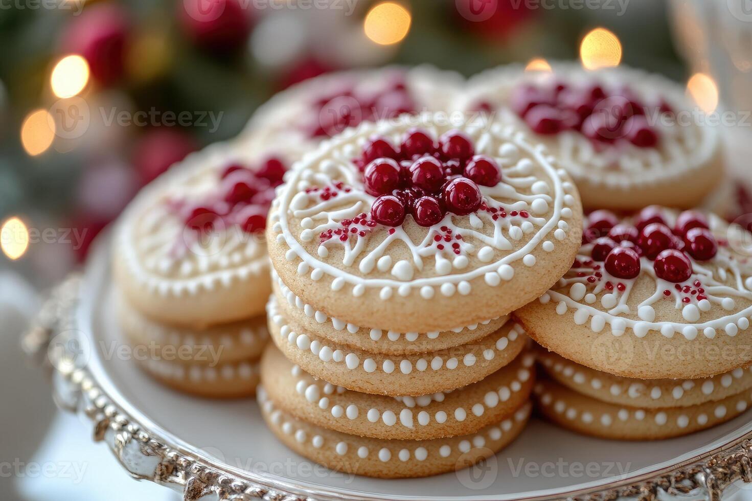Christmas linzer cookies decorated with royal icing and red berries on a plate photo