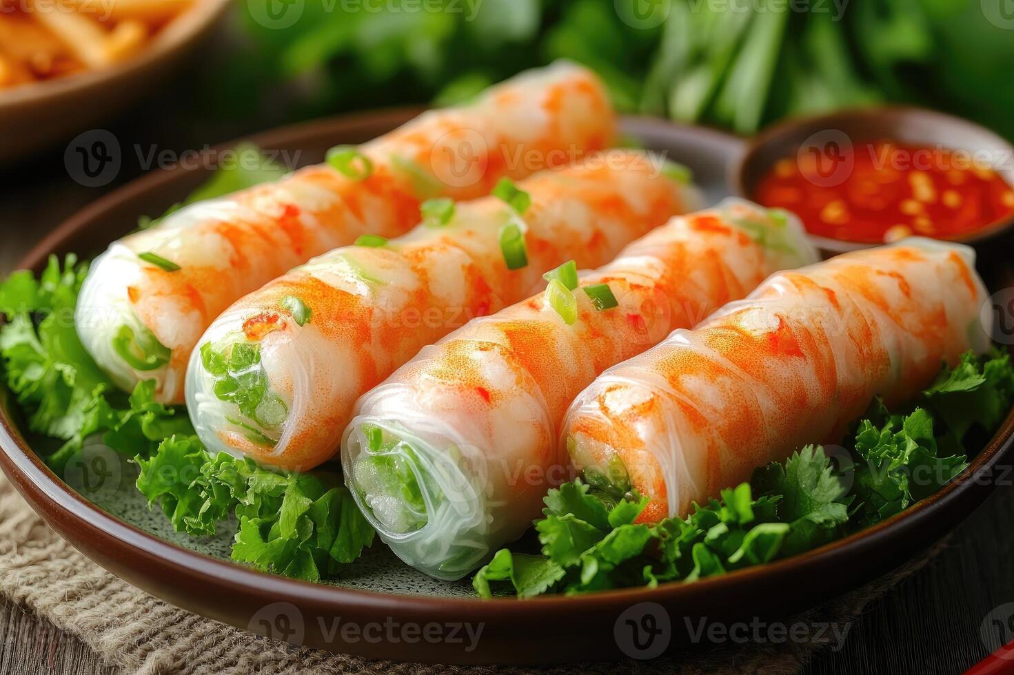 Delicious vietnamese spring rolls presenting with lettuce and dipping sauce photo