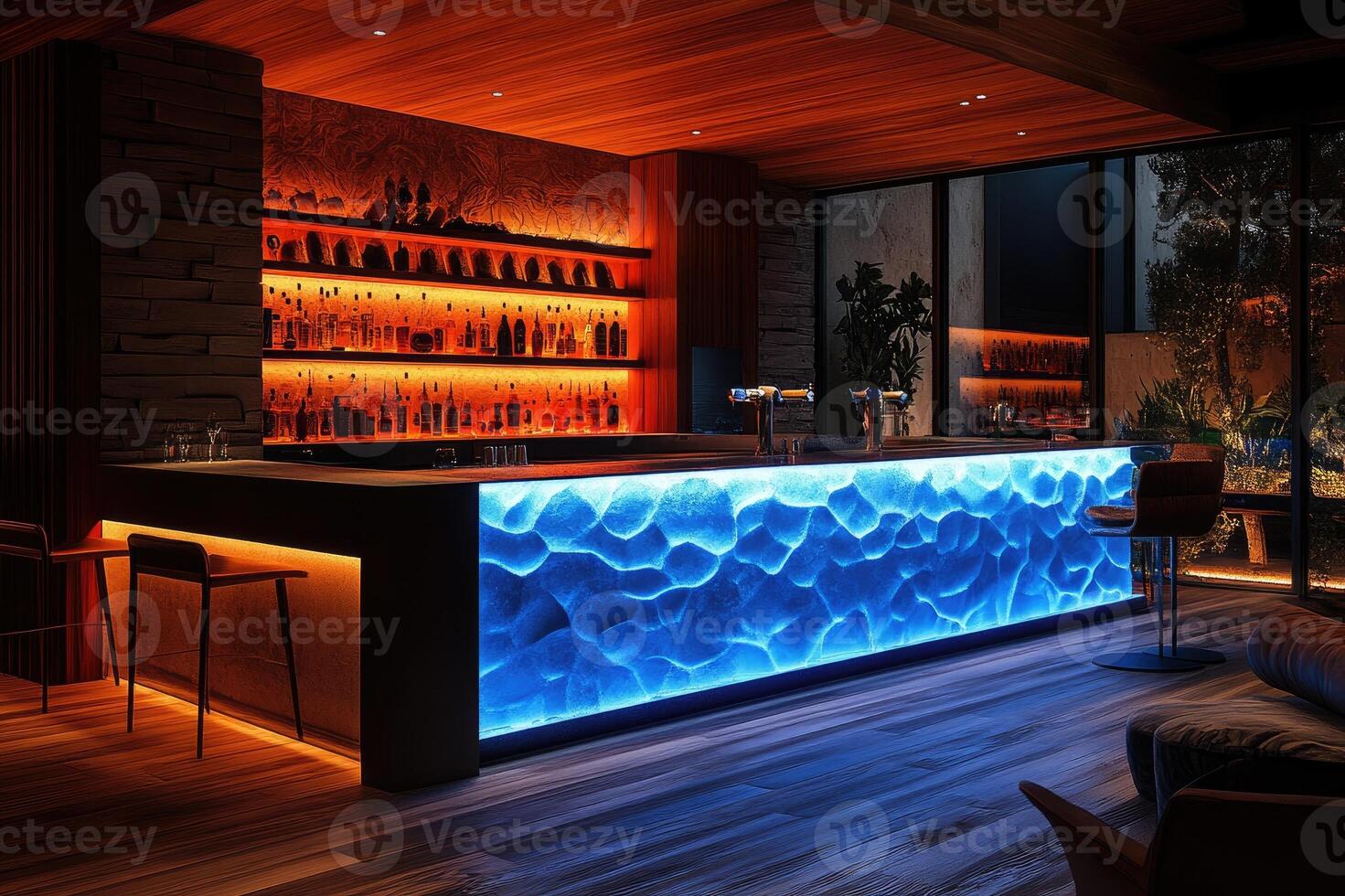 Modern bar with blue backlit countertop in luxury home at night photo