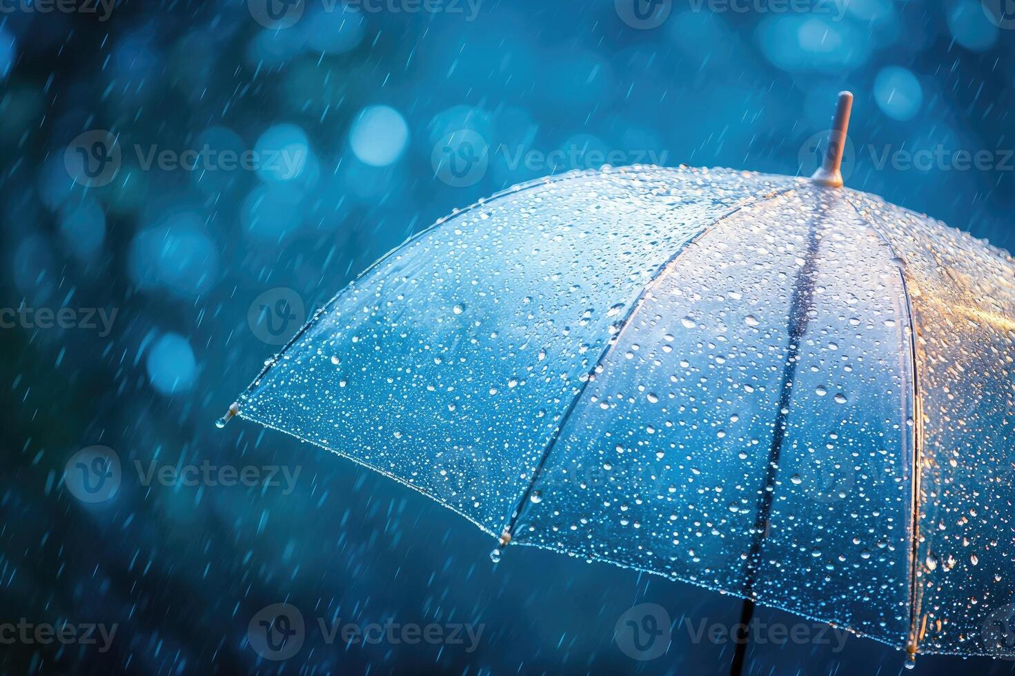 Transparent umbrella getting wet on a rainy evening in the city photo