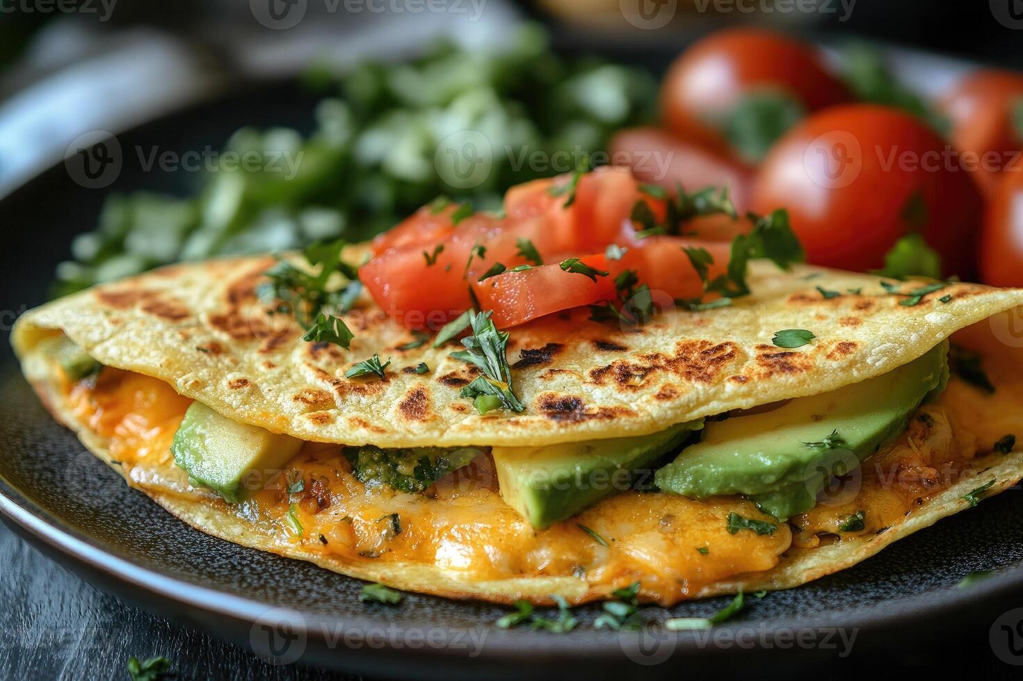 Savory quesadilla filled with cheese and avocado resting on plate photo