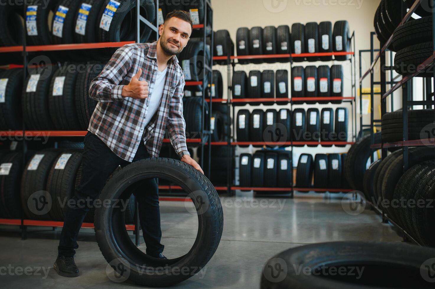 A male customer in a car tire shop photo