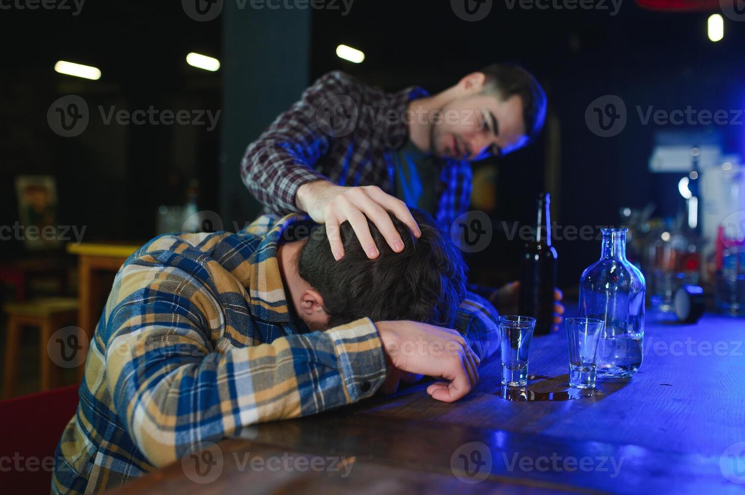 Sad man sitting at bar counter, alcohol addiction photo
