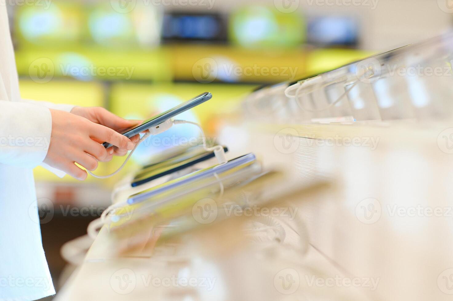 customer choosing a new mobile phone in a shop photo