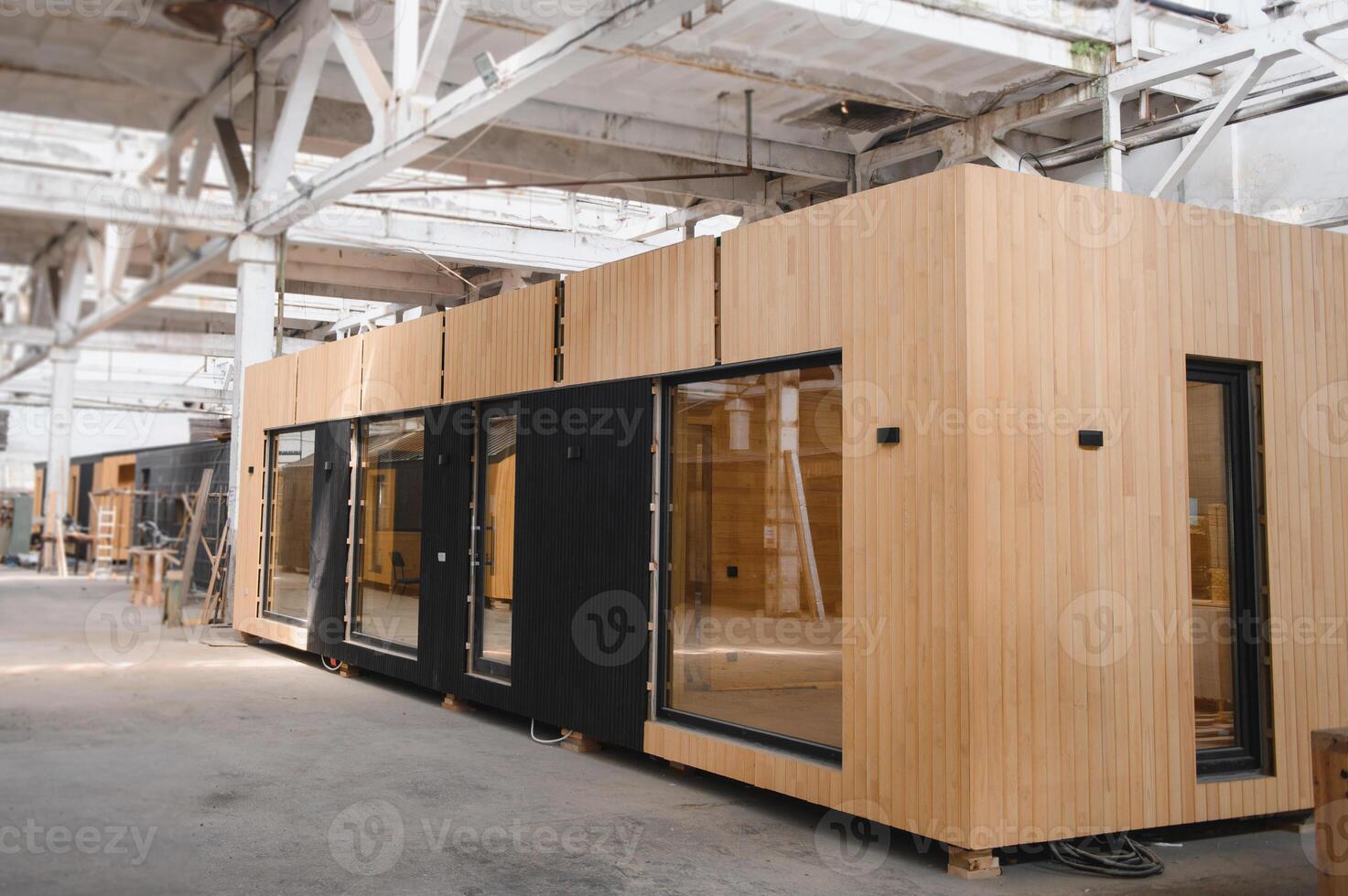 A new wooden modular prefabricated house inside in manufacturing facility photo