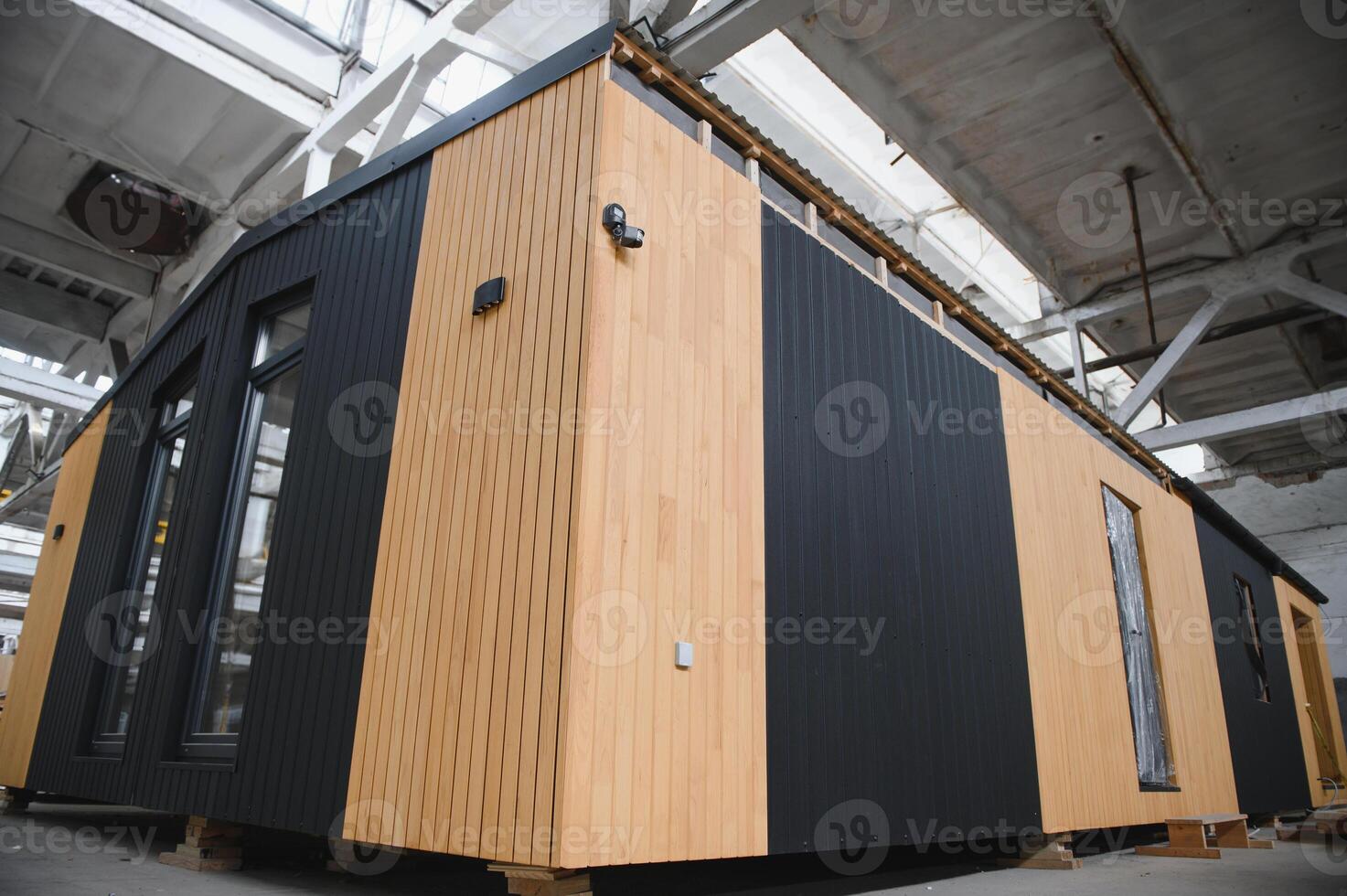 Newly built single storey prefabricated modular building. Prefabricated mobile wooden house at construction site photo