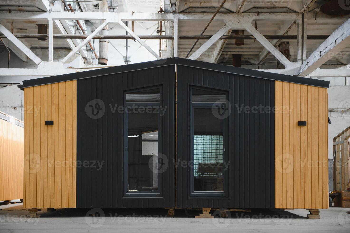 A new wooden modular prefabricated house inside in manufacturing facility photo
