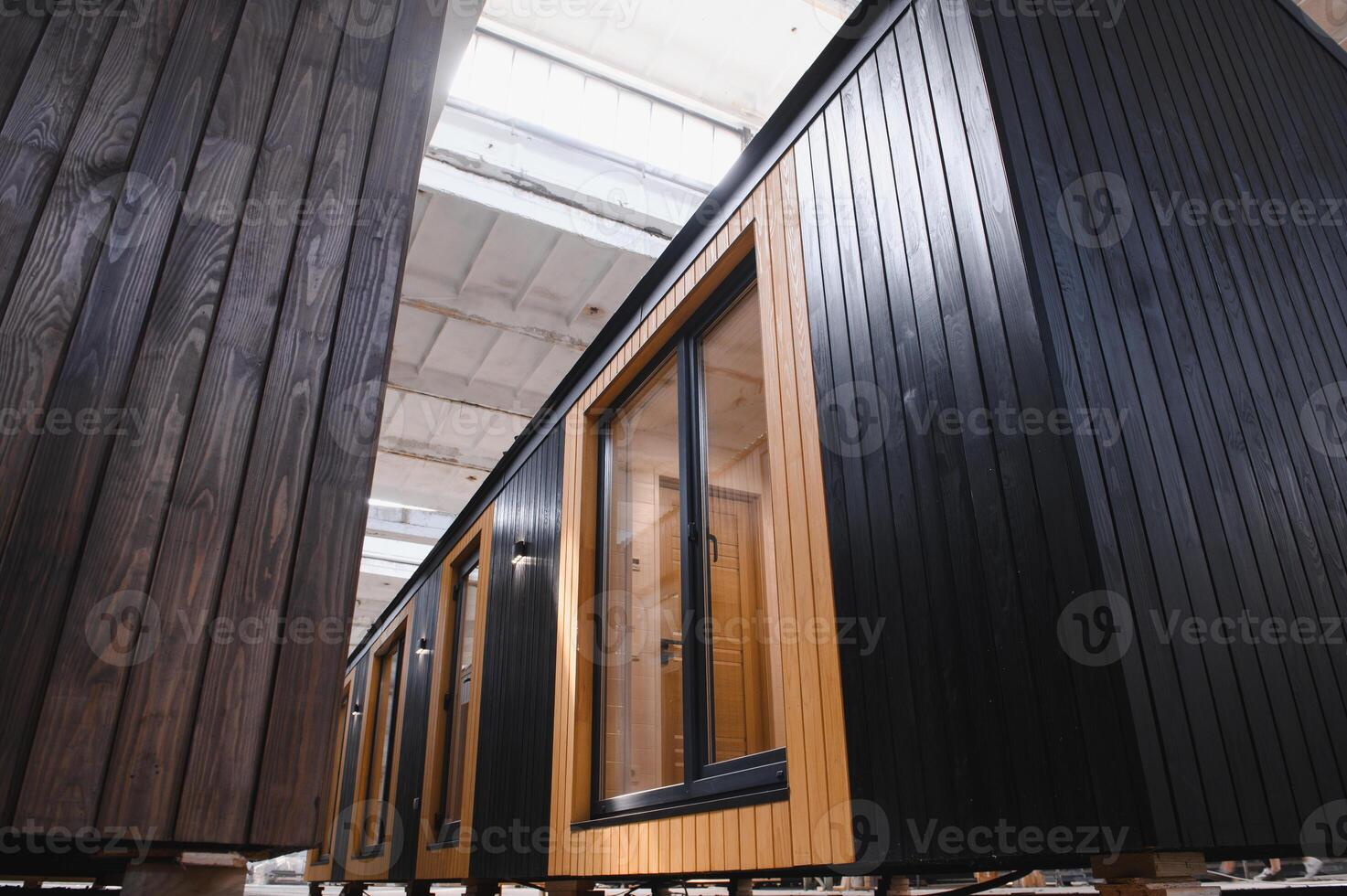 Production of new wooden modular houses. Construction site photo
