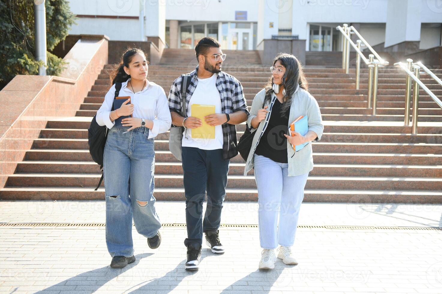 Cheerful Indian asian young group of college students or friends together photo