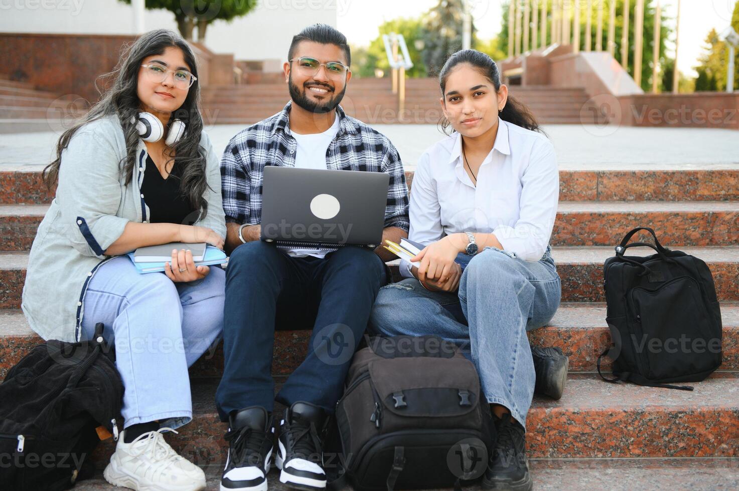 Cheerful Indian asian young group of college students or friends together photo