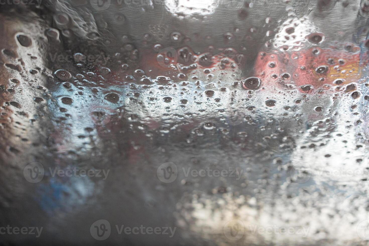 View from the inside of a car in an automated car wash. photo