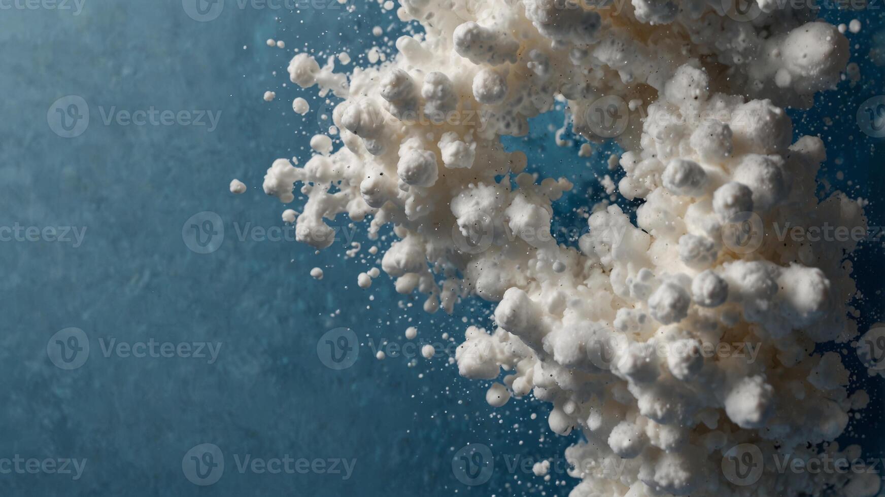 spot of thick shampoo foam on a blue background top view. photo