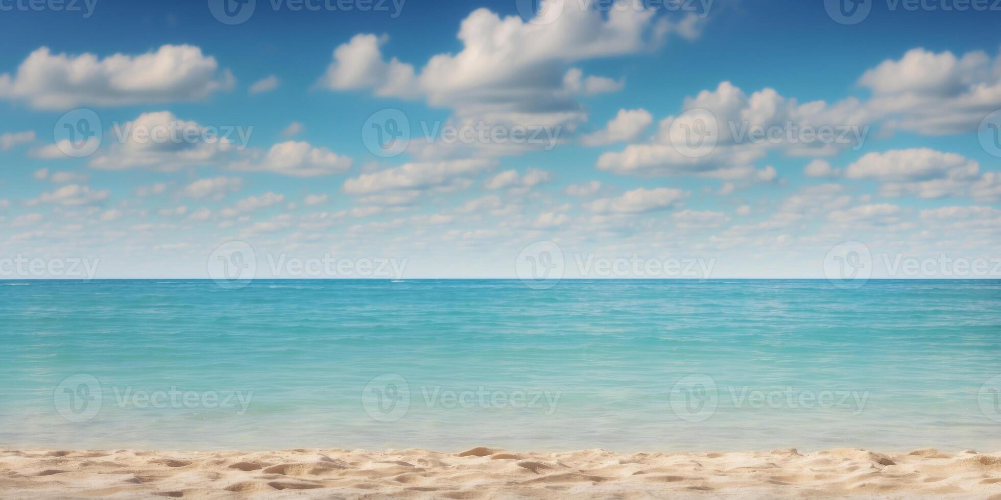A sandy beach by a crystal-clear body of water, beneath a vast blue sky dotted with scattered clouds. photo