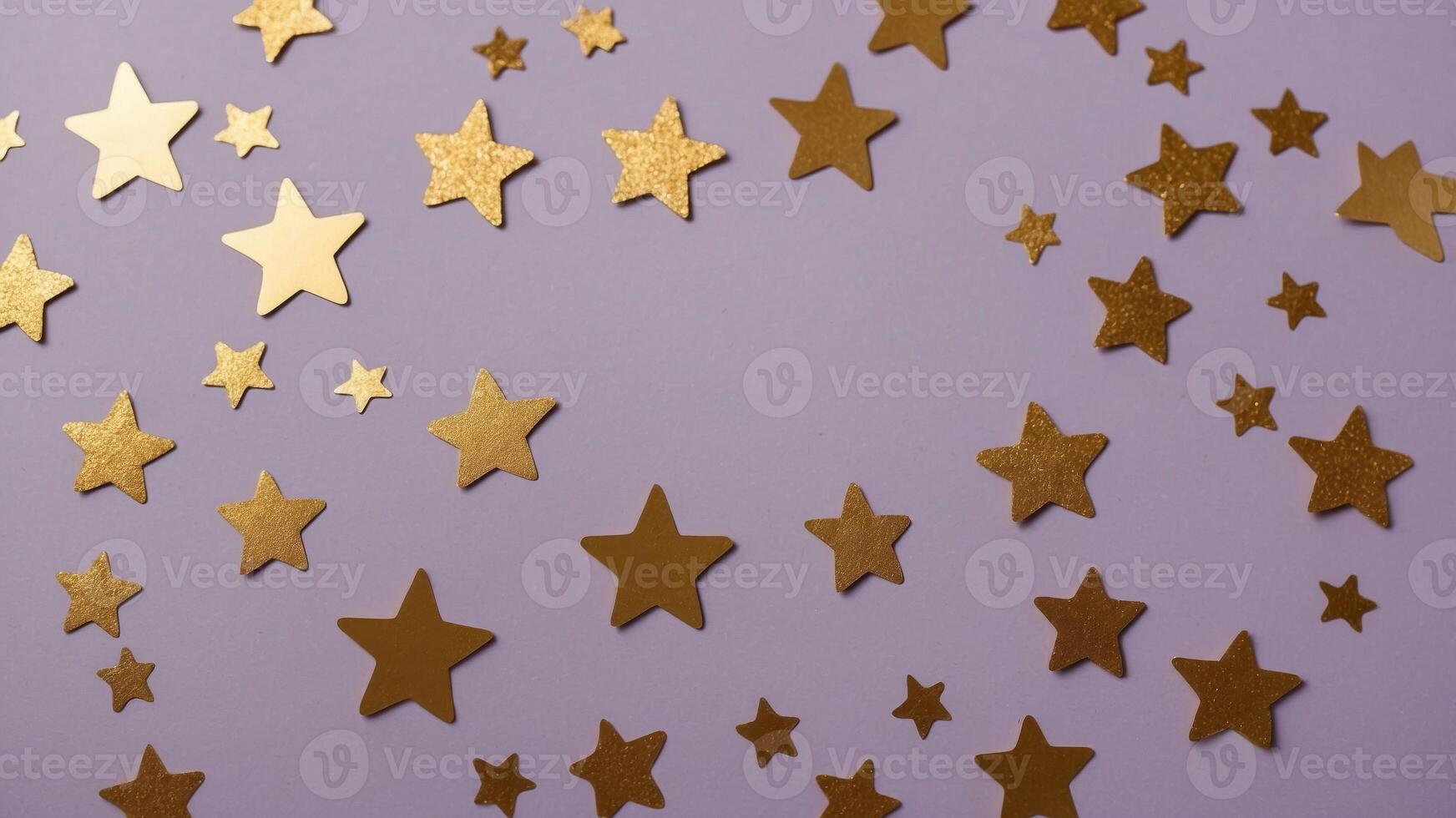 flat lay of gold foil shiny star shaped confetti and glitter scattered on a pastel purple background. photo