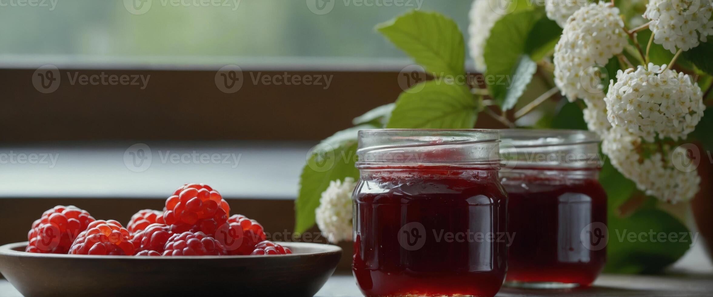 Delicious viburnum jam with fresh berrieson white table. photo