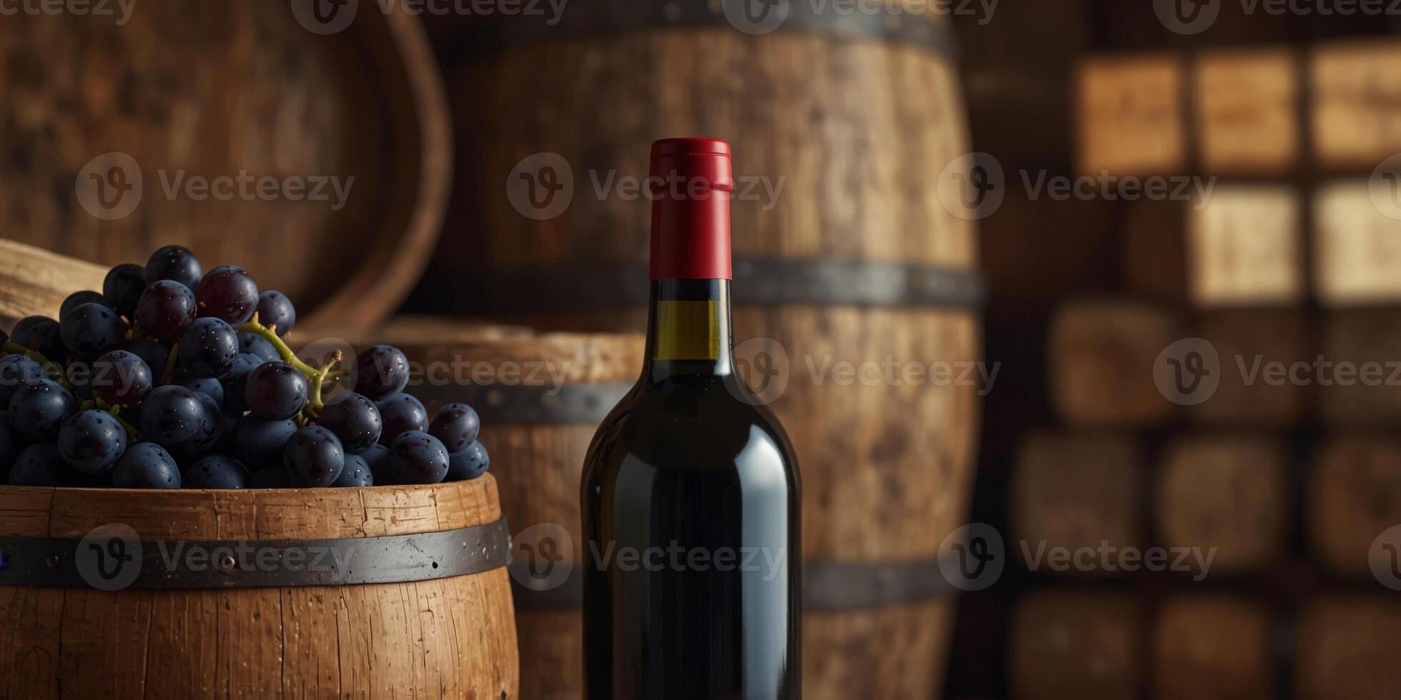 Wine Bottles and Grapes with Wooden Barrels in Background. photo
