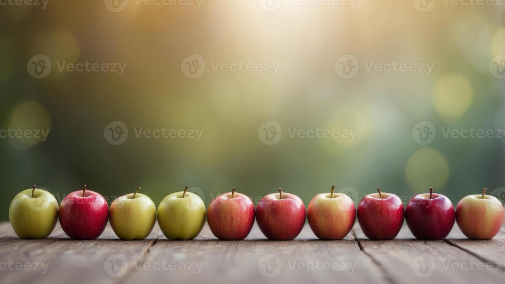 Row of colorful apples on a pastel background. photo