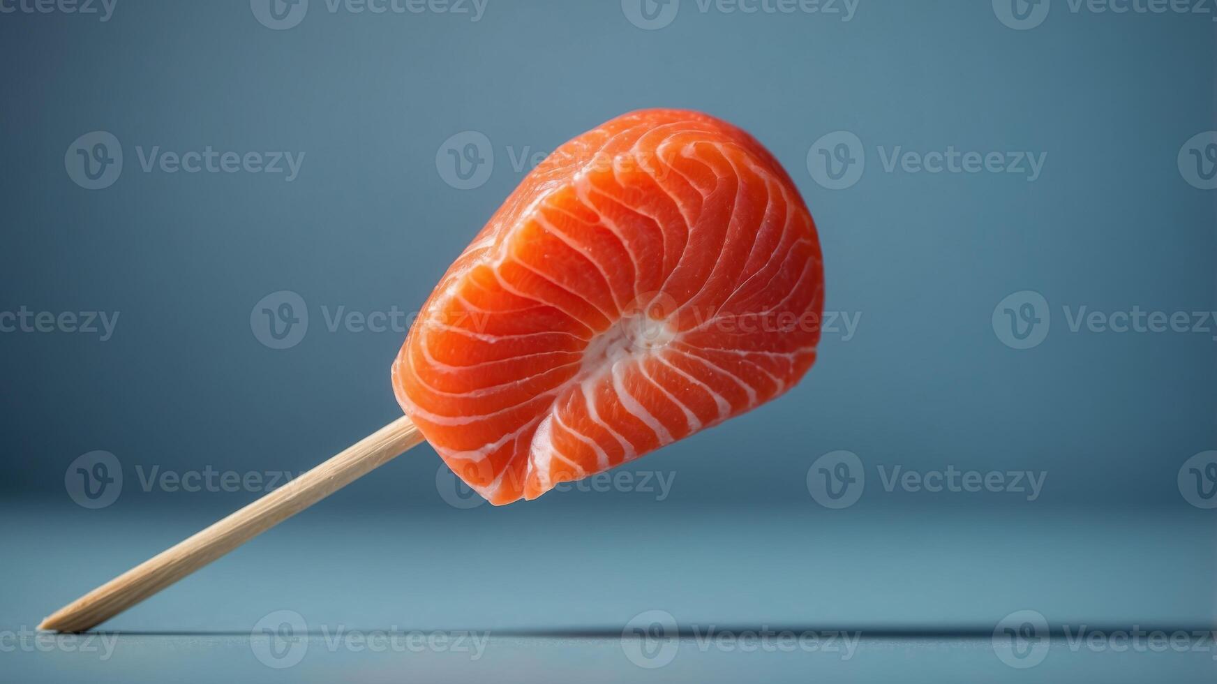 Slice of salmon like a lollipop on blue background Minimal food concept Side view. photo