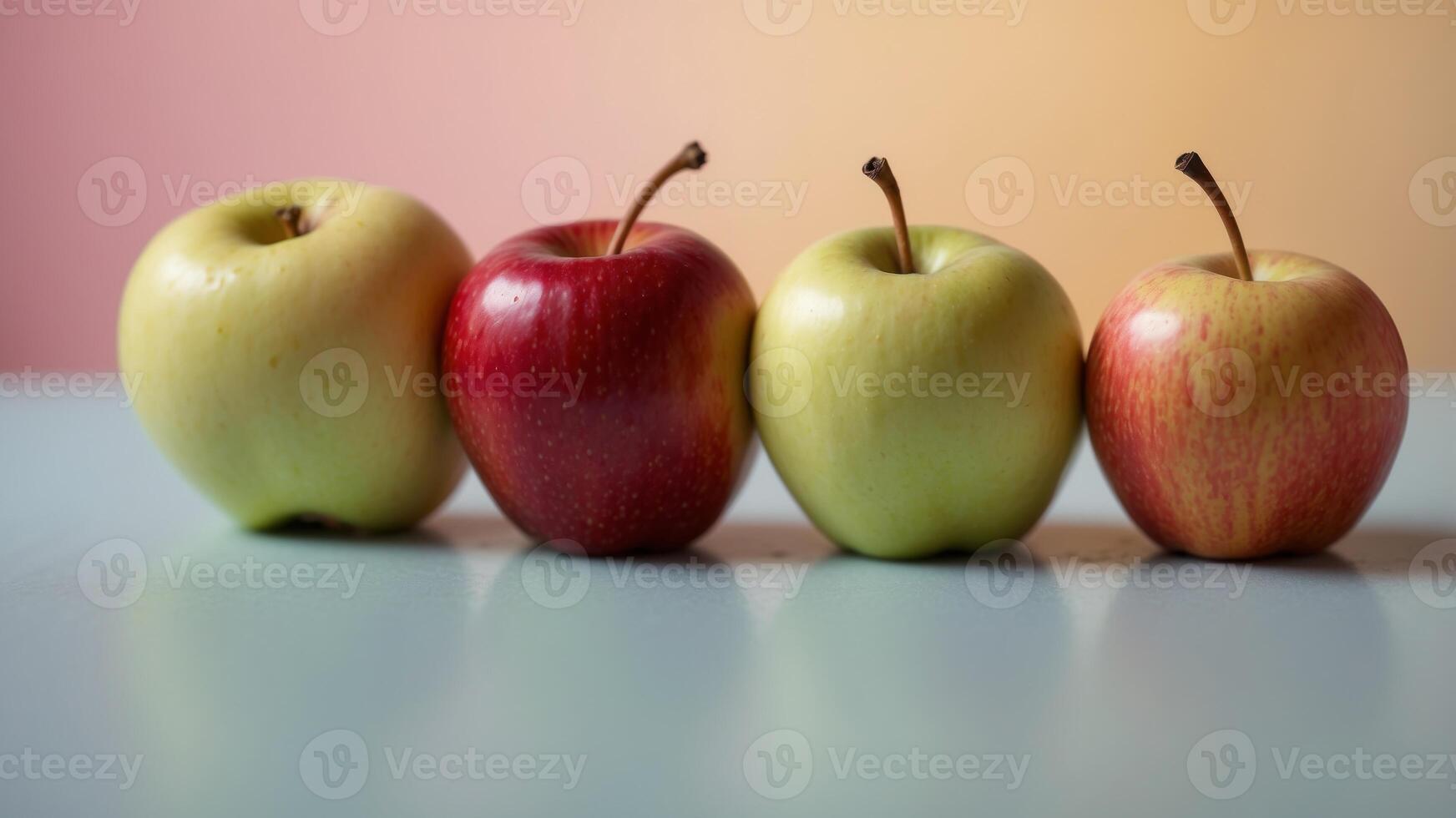 Row of colorful apples on a pastel background. photo