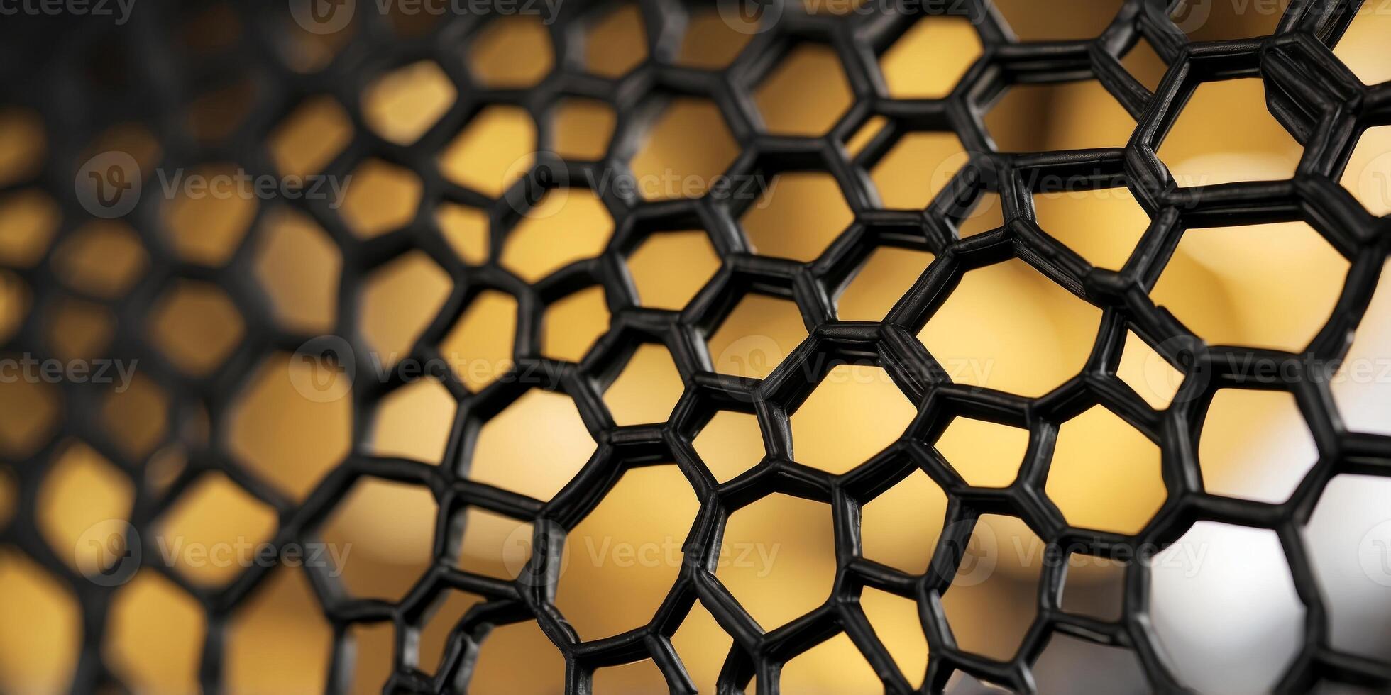 abstract yellow and black perforated structure resembling honeycomb. photo