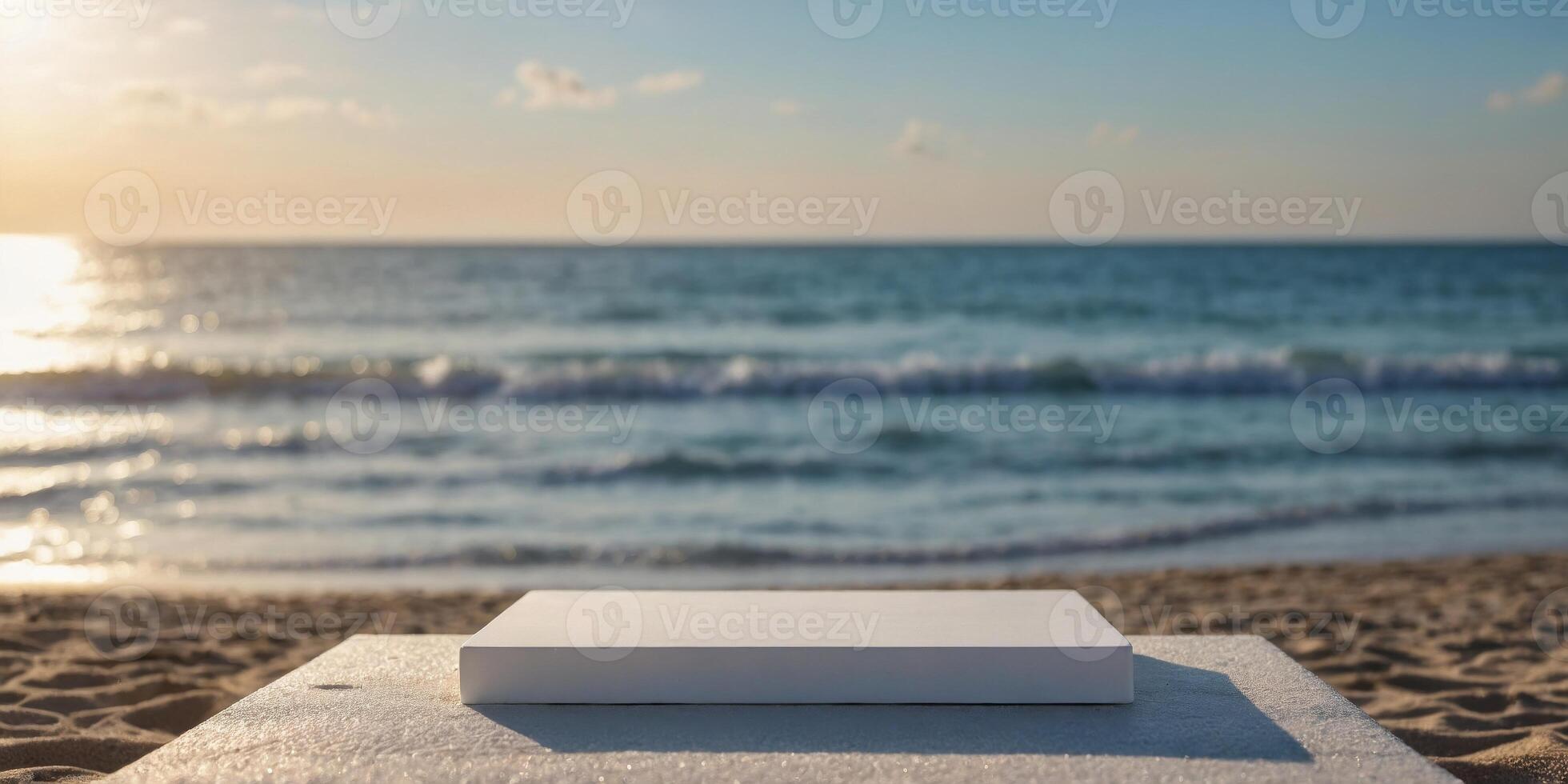 Empty white square shaped podium with beach in blurry background. photo