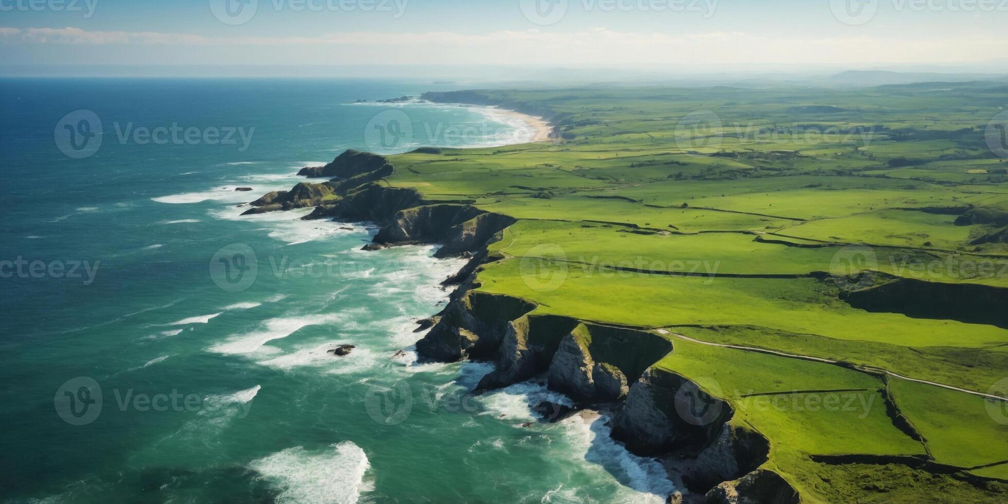 Aerial View of Rugged Coastline with Green Fields. photo