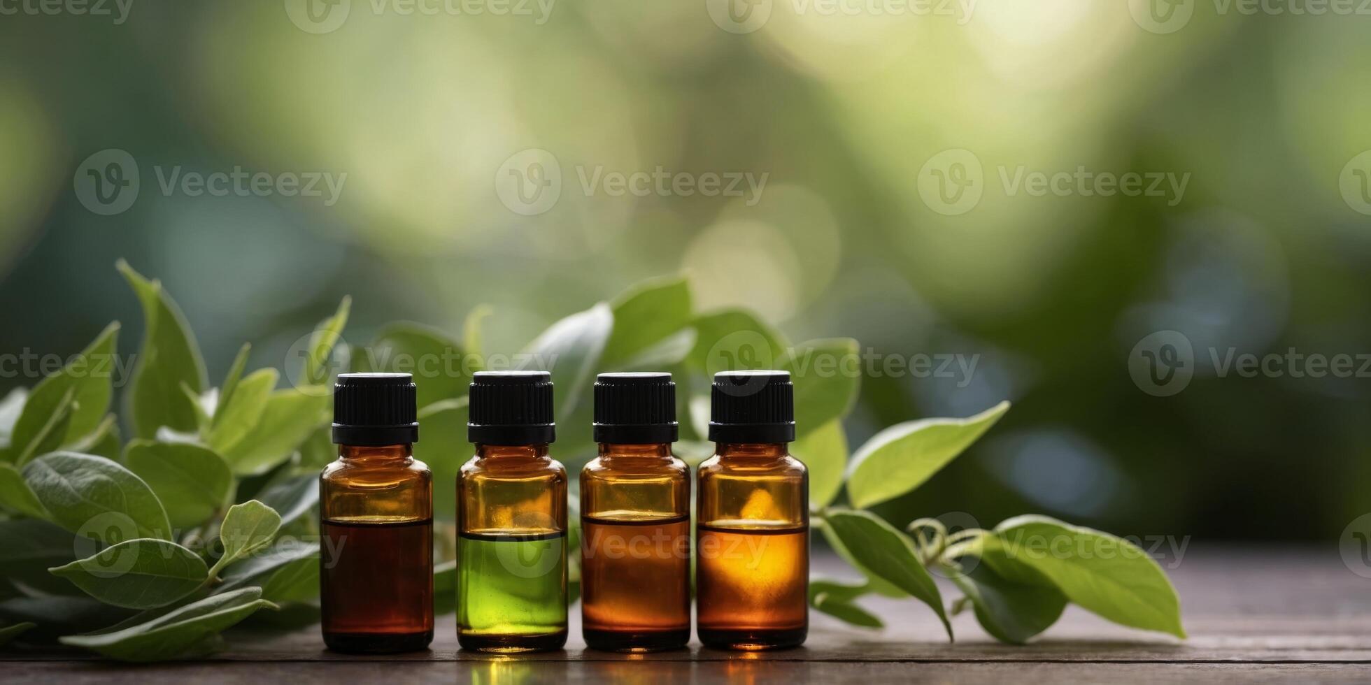 Essential oils in bottles surrounded by fresh leaves. photo