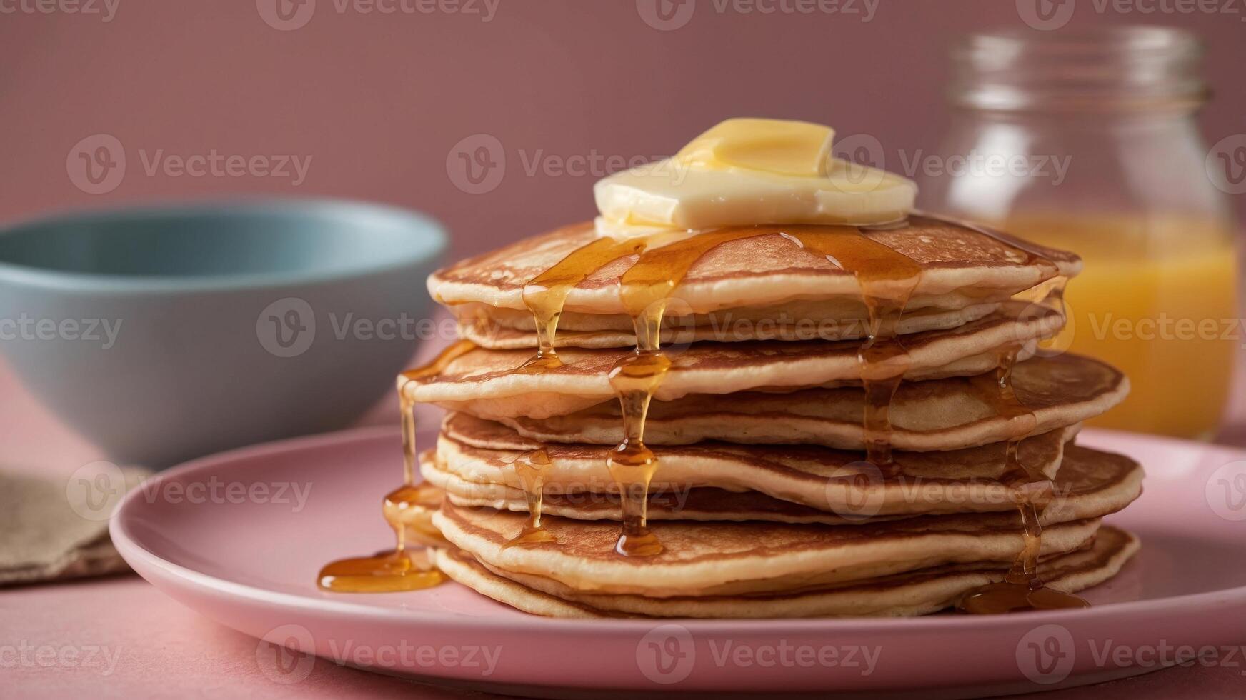 stack of freshly fried American pancakes with butter on a pink background. photo