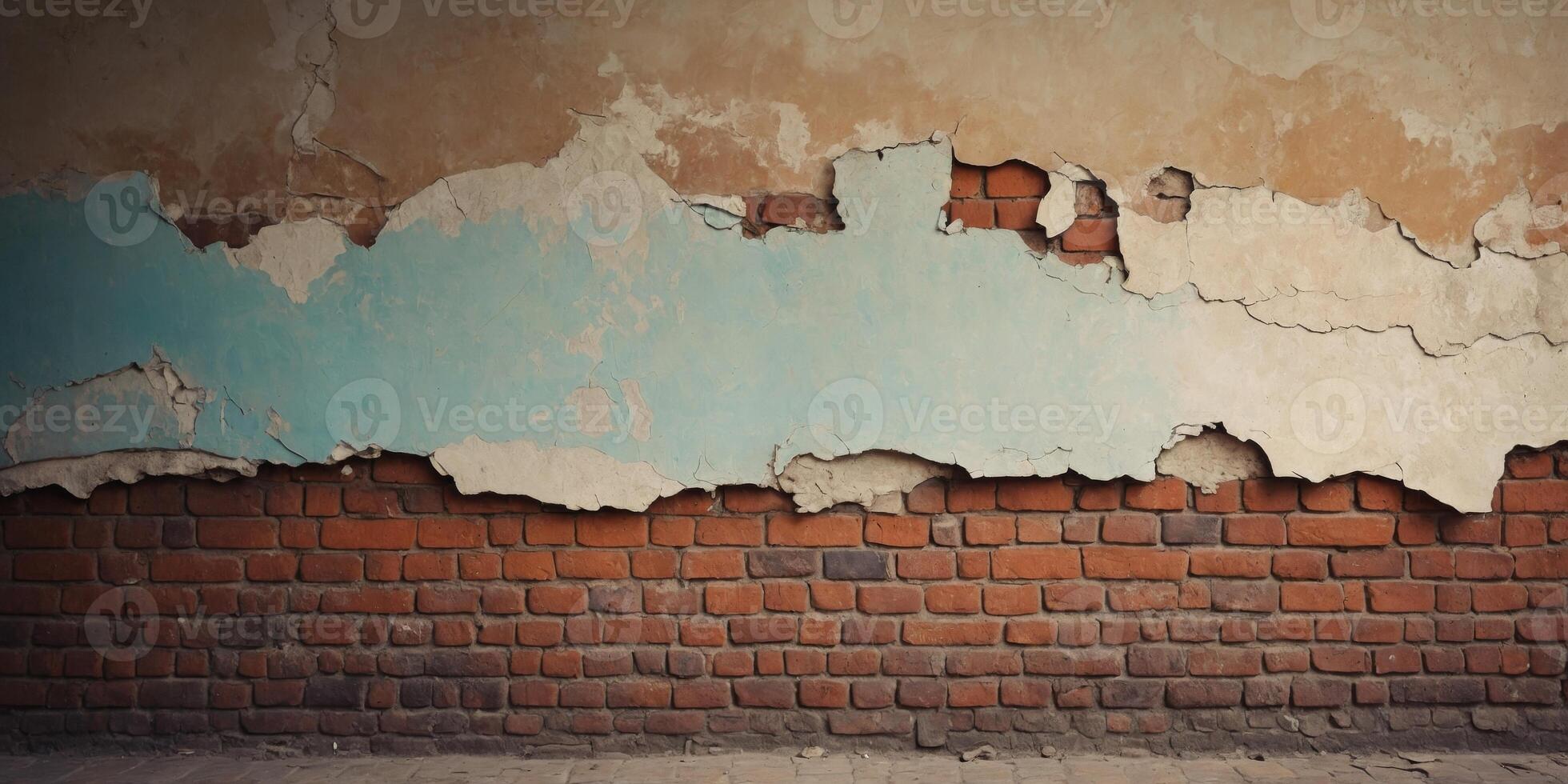 Weathered brick wall with peeling plaster and exposed bricks. photo