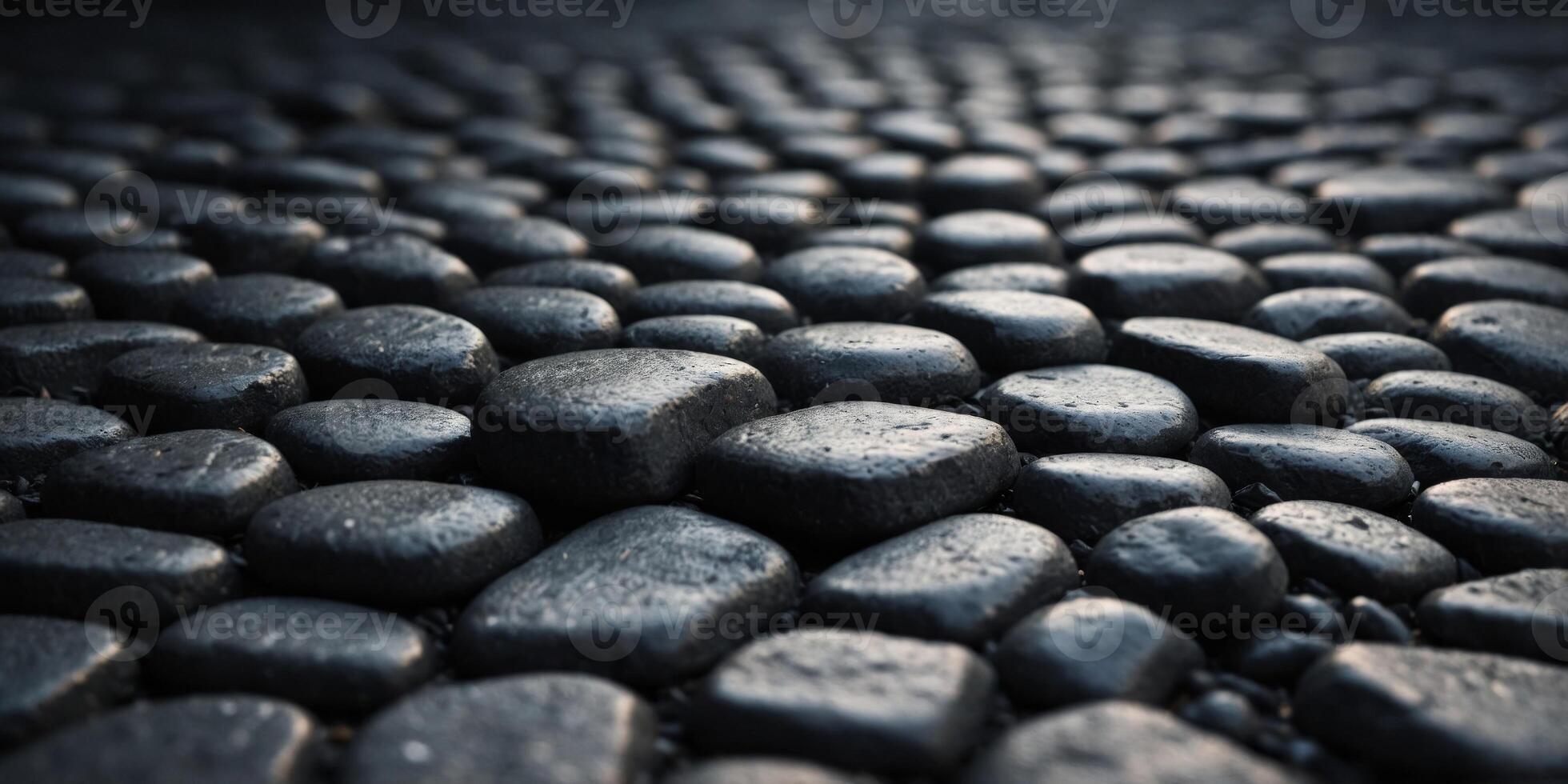 Dark irregular gray cobblestone background. photo