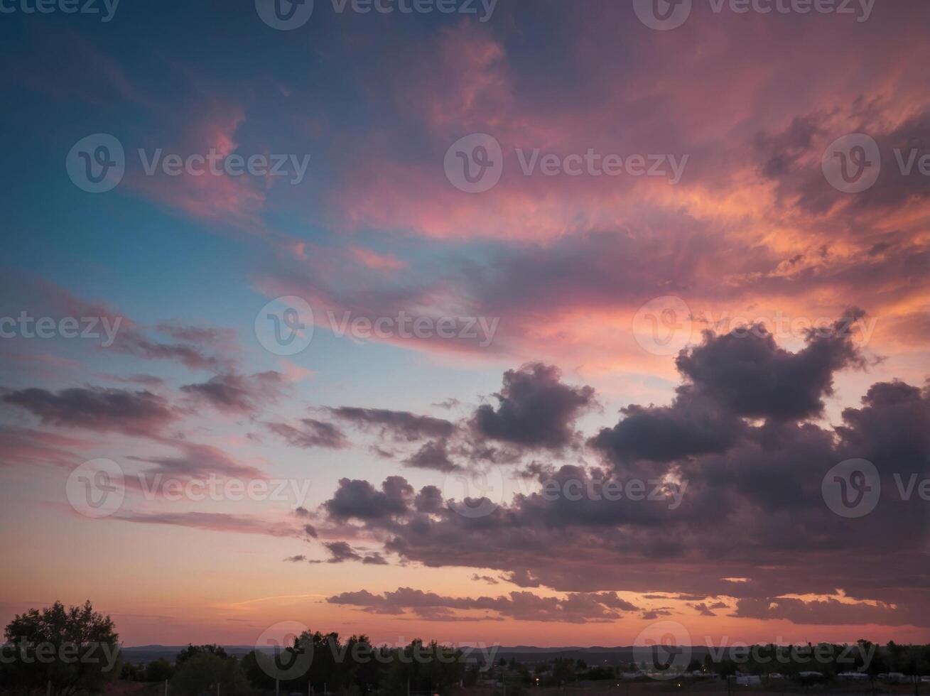 A blurred image of a pink and blue sky with cloudy and sunny areas. photo
