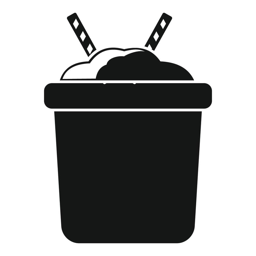 Black silhouette of a bucket with sand and two shovels sticking out of it vector