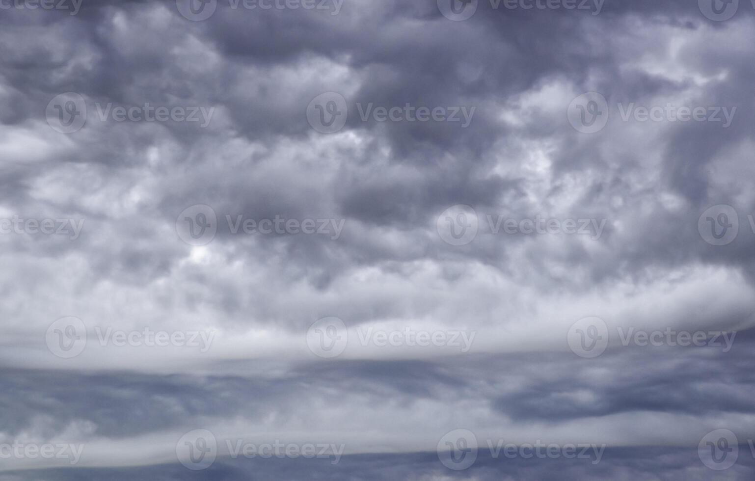 gloomy gray low clouds, dramatic sky background photo