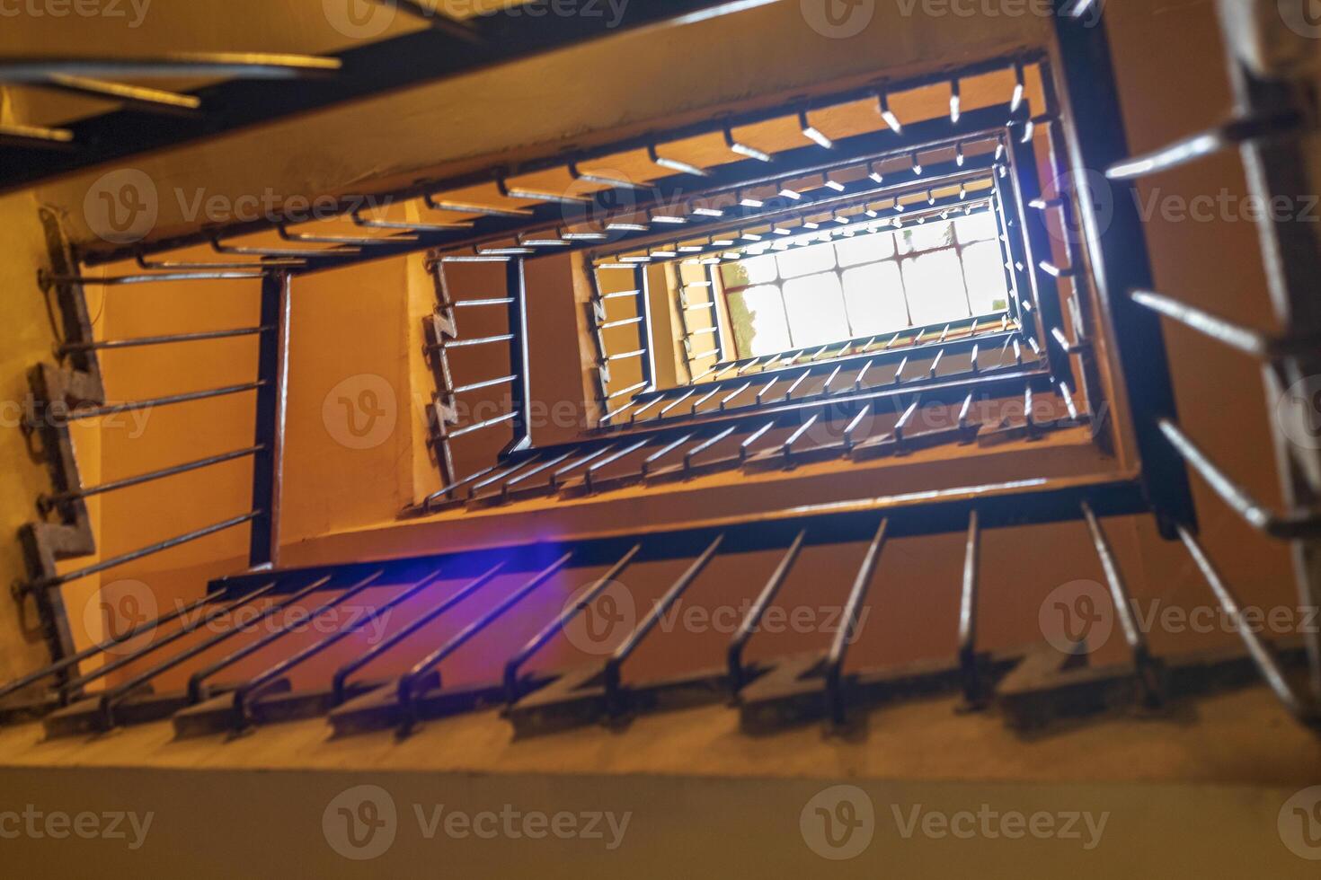 Up view of the staircase in the building. Horizontal view photo