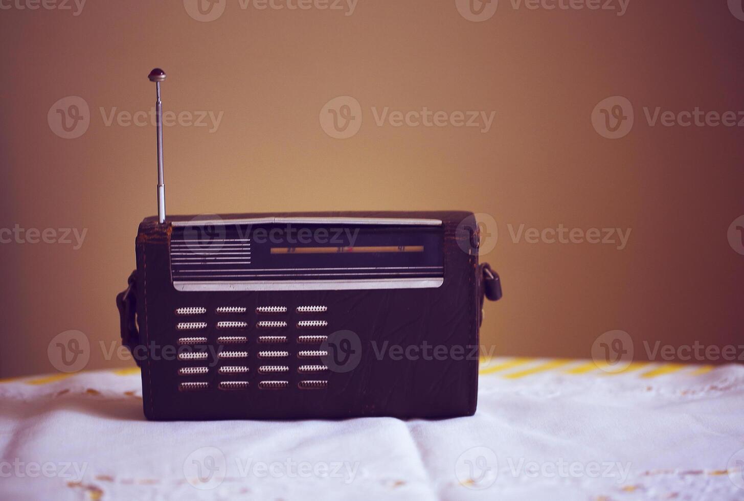 a small radio sitting on a table photo