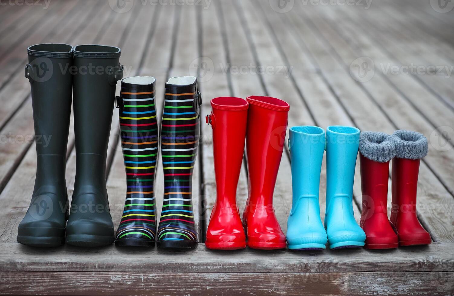 Five pairs of a colorful rain boots photo