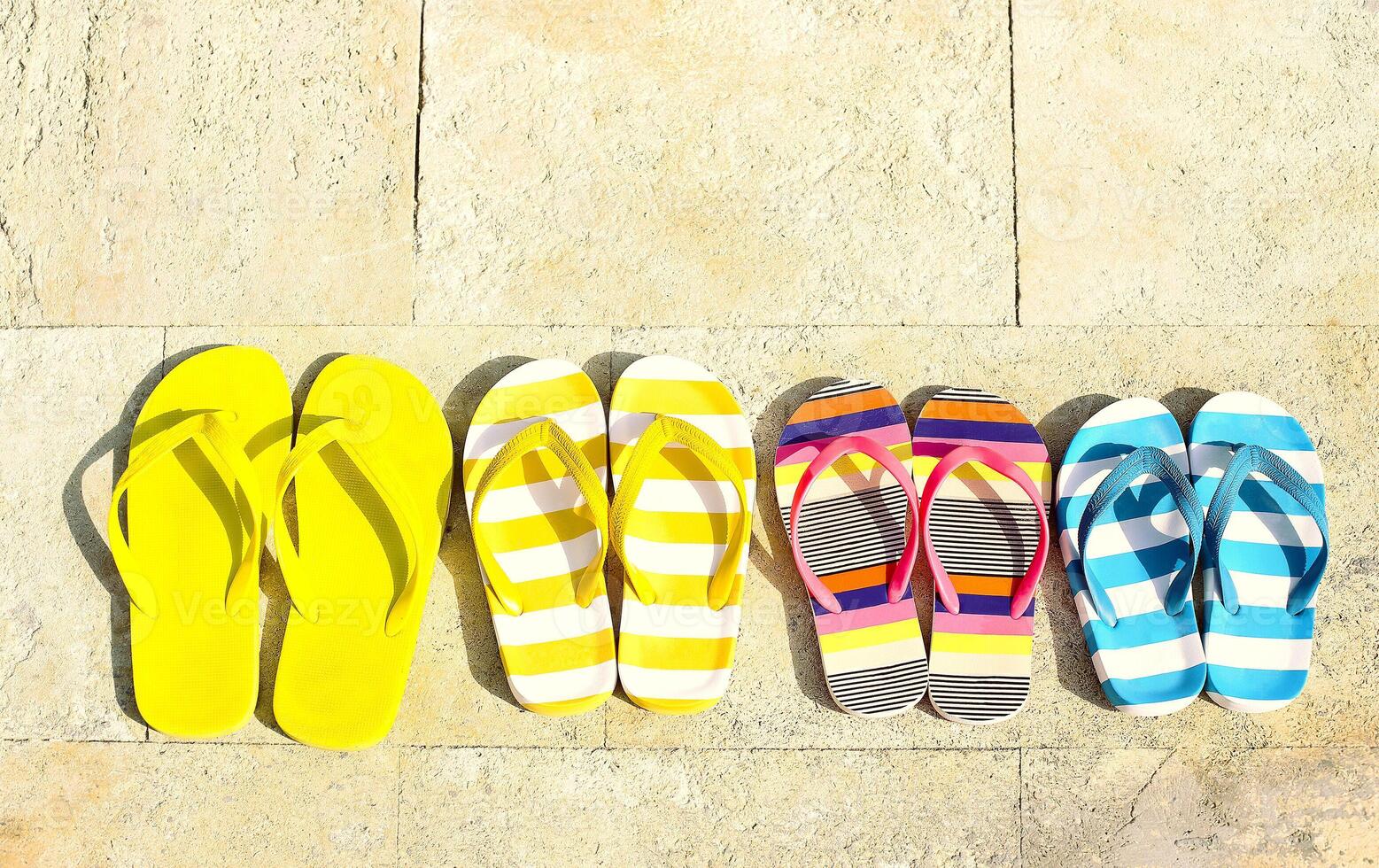 Flip flops on stone background photo