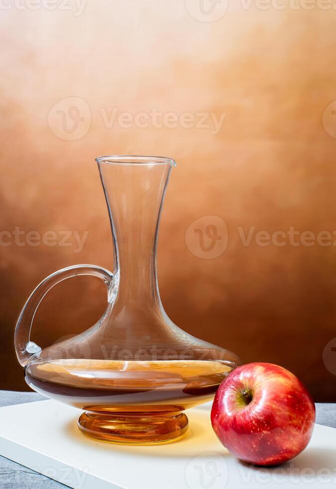 Apple Juice in Glass Decanter with Fresh Apple photo