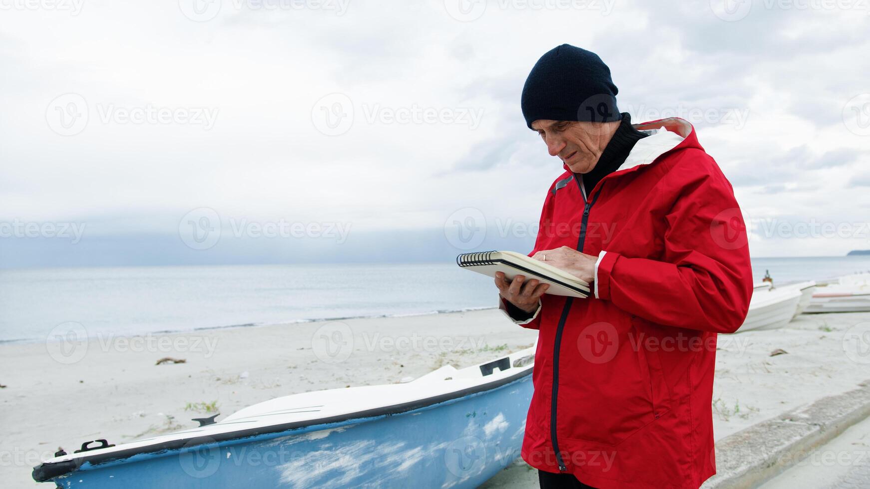 Man Reading From His Notes photo