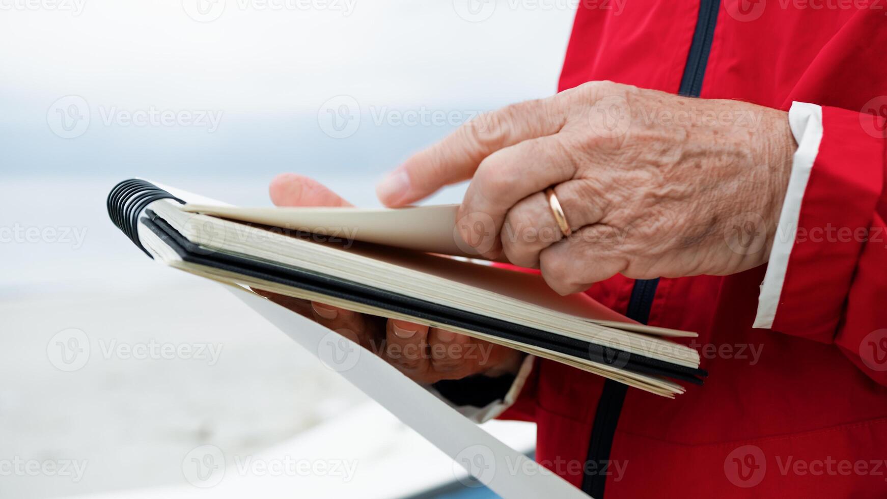 Man Turning Pages Of The Block Notes photo