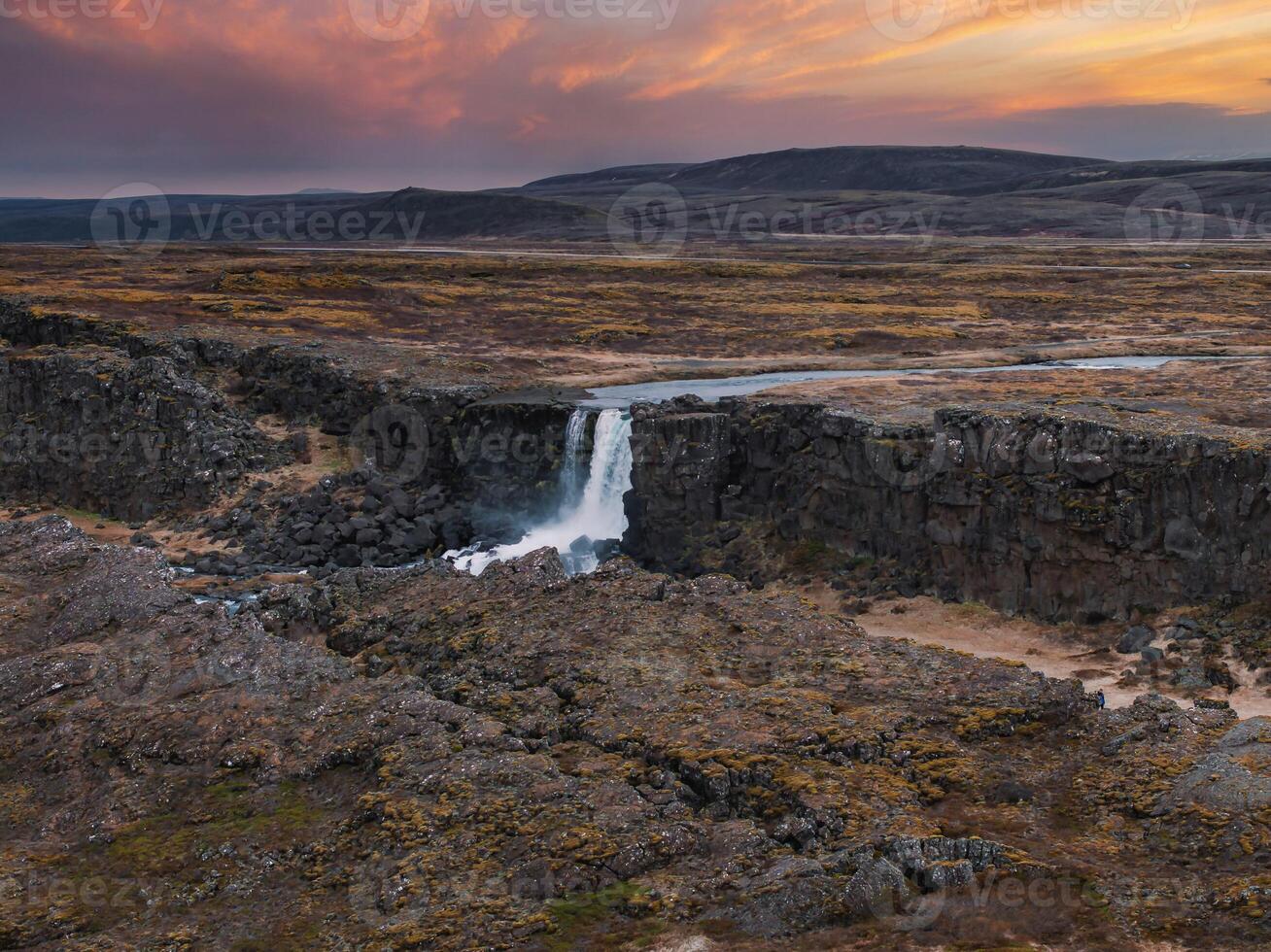 Aerial panorama of the Oxarafoss waterfalls in Iceland. Oxarafoss also called Oxararfoss is located in the Thingvellir National Park on the Oxara River. The tectonic plates of America and Eurasia. photo