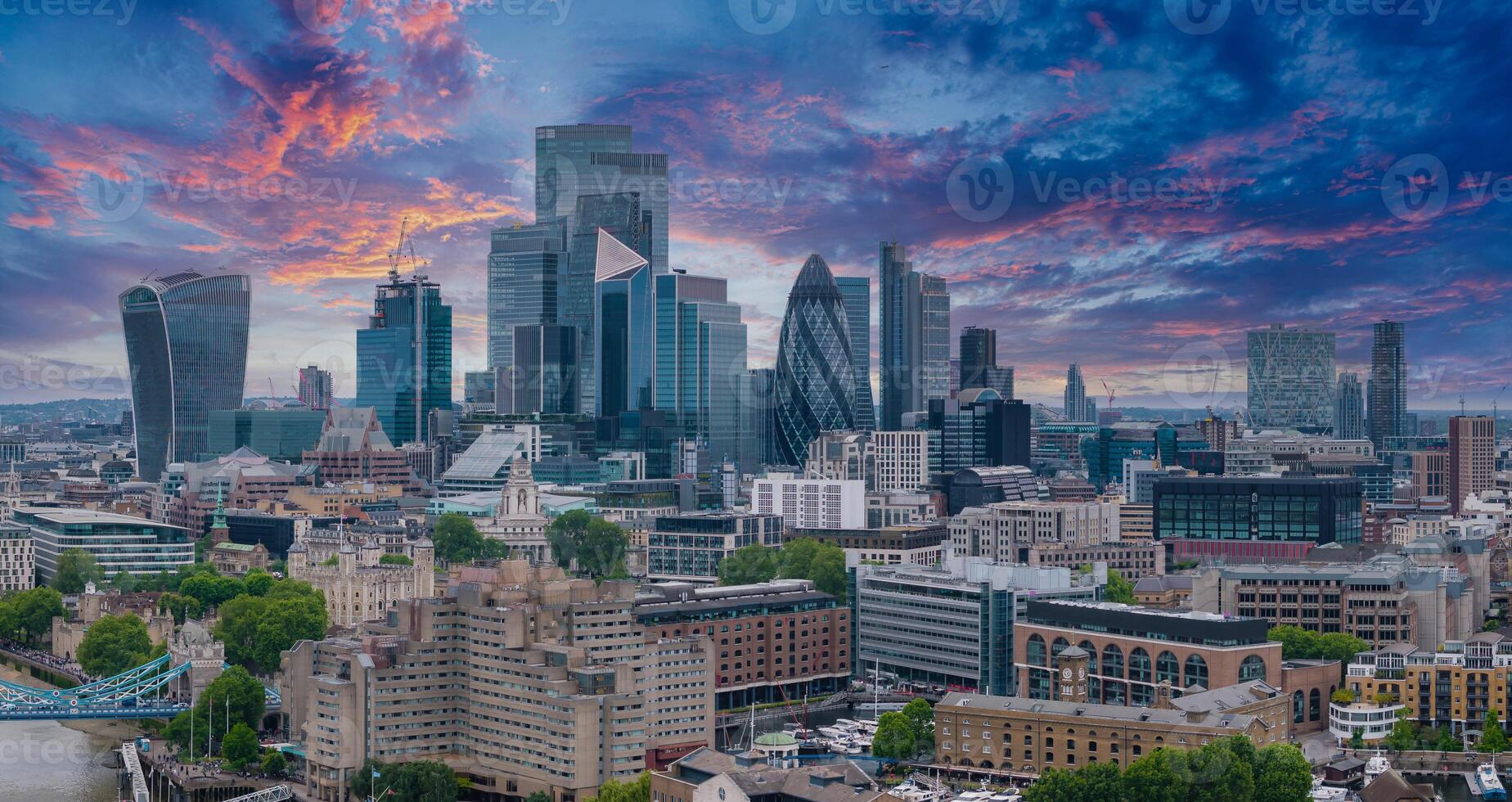 Aerial panoramic view of the city of London business center. Close up view of the riverside near river Thames. photo
