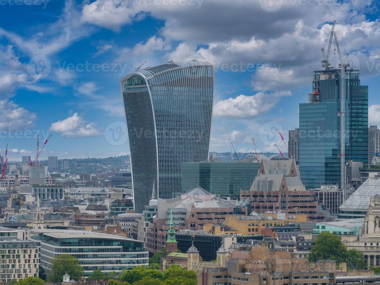Aerial panoramic view of the city of London business center. Close up view of the riverside near river Thames. photo