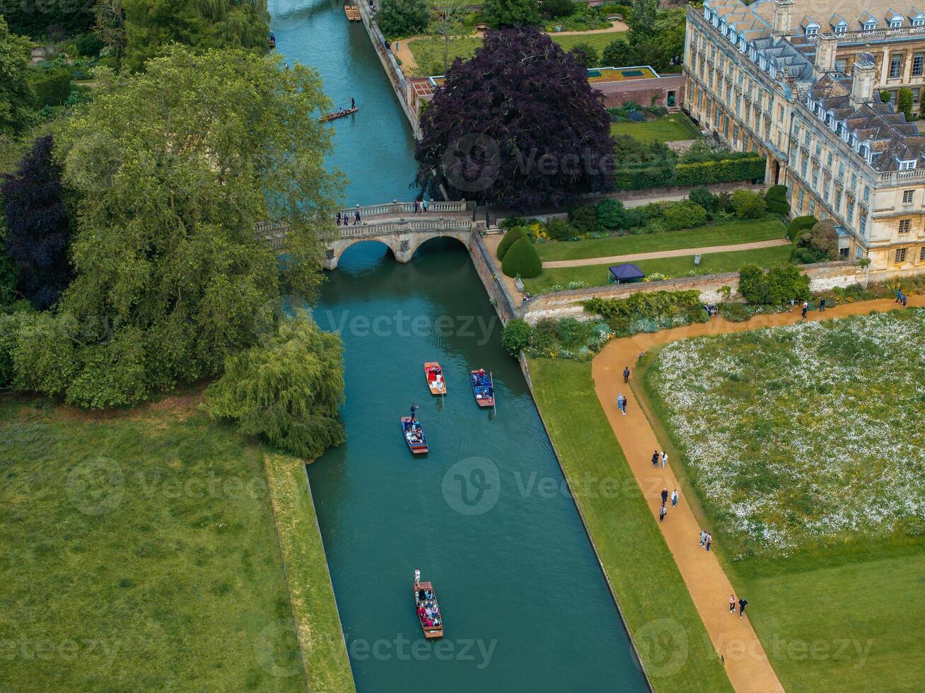 Aerial view of the old town of Cambridge with narrow canals and river boats near a Kings College Chapel in the center of Cambridge, Cambridgeshire, England. photo