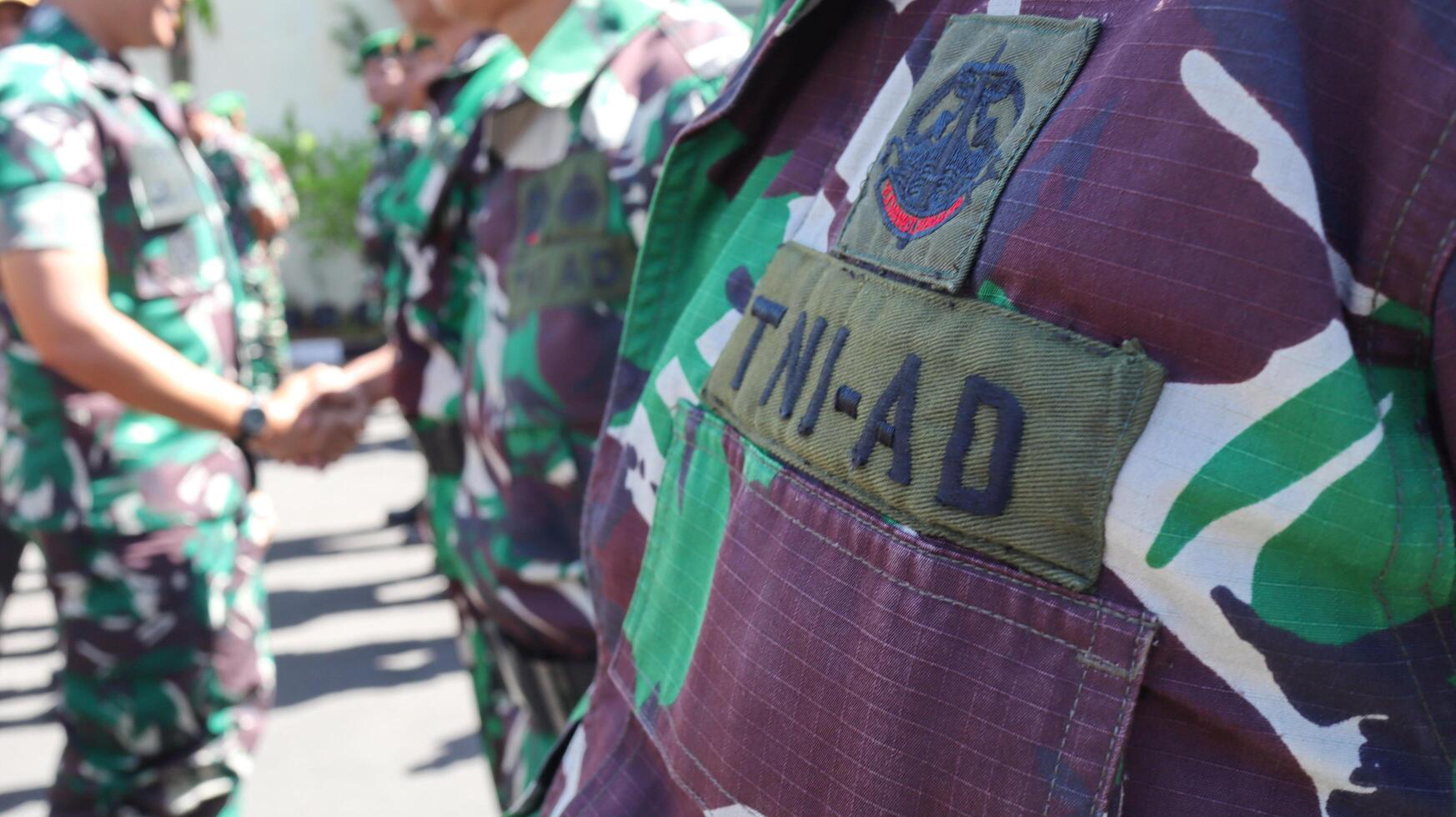 The Indonesian Army or TNI AD are conducting a parade of troops photo