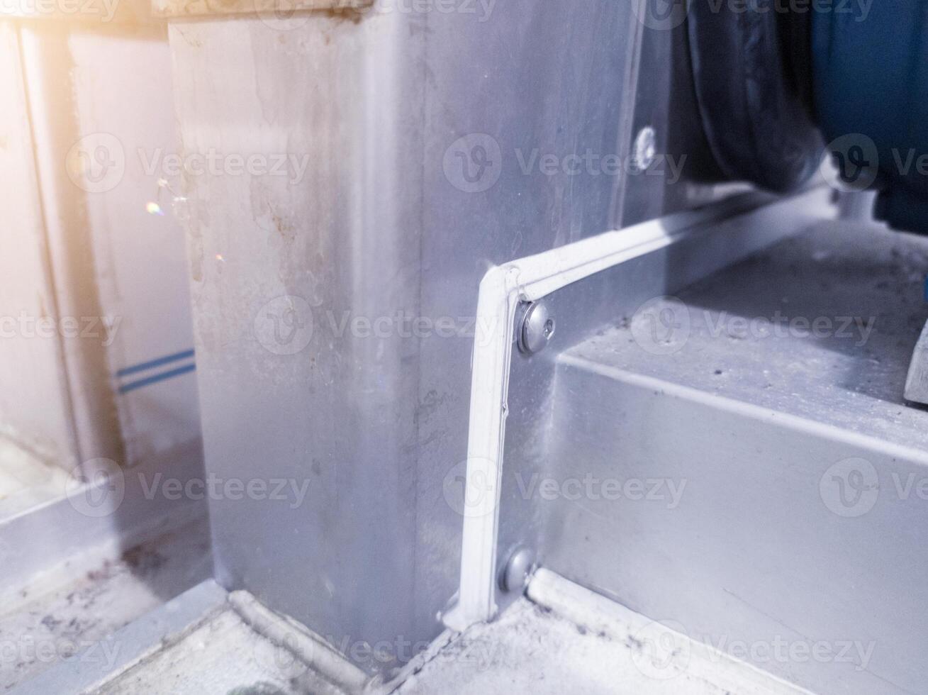 Rubber sealer for metal plate connect machine frame. photo